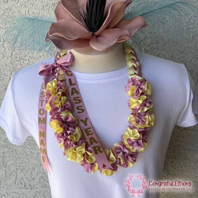 Soft plumeria-style ribbon lei in blush tones